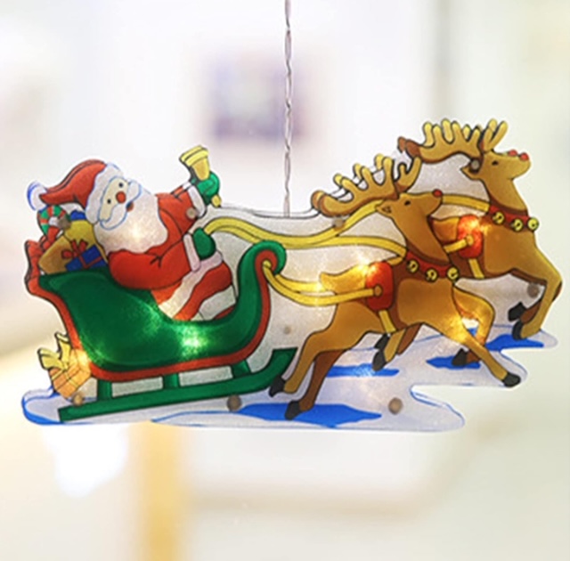 Závěsná 3D vánoční LED dekorace Santa na saních se soby